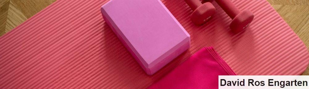 pink dumbbell on pink textile