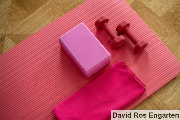 pink dumbbell on pink textile
